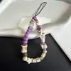 Diseño original de moda en esquema de colores púrpura taro, amuleto para teléfono con diseño de estrella de mar y hueso, cadena para teléfono, cadena para cámara CCD