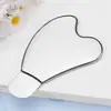Venta al por mayor del fabricante Tabla raspadora con forma de corazón de acero inoxidable Palo de masaje de belleza facial Masajeador de ojos Multifuncional Universal para todo el cuerpo