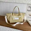 Bolso de lona transfronterizo 2026 nuevo, estilo ins, de alta gama, gran capacidad, para viajes y uso diario, de hombro/cruzado