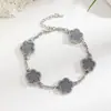 Atacado de fabricantes de joias para pés com design personalizado, tornozeleira de trevo de cinco folhas da moda de alta qualidade, vendida em alta no exterior, não desbota
