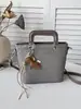 Bolso de cubo de moda con patrón tejido para mujer, nuevo estilo coreano 2026, bolso de mano versátil para salidas diarias y para ir al trabajo, bolso cruzado