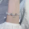 Pulsera de pareja para novias transfronterizas, imitación de ojo de gato, piedra lunar, campana, pulsera de cristal, pulsera de cuerda elástica, venta al por mayor
