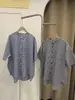 Cardigan Camisa de Manga Curta com Gola Alta Xadrez Verificado Bolso no Peito 88437 Camisa Xadrez Em Estoque Atacado