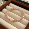 Pulsera de cuerda elástica de cuentas de mijo de perlas de agua dulce naturales no se desvanece nicho super hada todo-combinable accesorios de pulsera de perlas