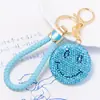 Llavero de Arcilla con Cara Sonriente de Pedrería de Doble Cara Colgante Pequeño Accesorio Pequeño Cordón de Cuero Creativo Llavero de Metal Al por Mayor