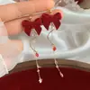 Pendientes de Borlas con Lazo Rojo 2026 Nuevo Estilo Caliente Lujo Ligero Gama Alta Pendientes de Año Nuevo Accesorios de Oreja Únicos de Nicho
