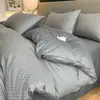 Juego de cuatro piezas de jacquard de algodón de fibra larga de lujo ligero de alta gama, sábana de algodón puro, funda de edredón, sábana bajera, ropa de cama para hotel y casa de huéspedes