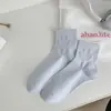 Calcetines deportivos de primavera y verano nuevos de estilo preppy con cara sonriente de color sólido para estudiantes, lindos calcetines cómodos y transpirables, calcetines finos para mujer