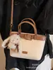 Bolso pequeño súper popular para mujer, nuevo modelo de verano 2026, bolso cruzado tipo cubo de nicho de alta gama para el día a día