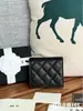 Billetera corta de cuero de vaca de primera capa con patrón de bola de Xiaoxiang, plegable a la mitad, con monedero dentro de la billetera, súper práctica, de alta gama, marca grande