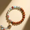 Pulsera natural de doble hilo estilo chino hecha de madera de ciprés, palo de rosa de hoja pequeña, madera de durazno y madera de loto para mujeres, y cuentas budistas de madera para hombres.
