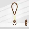 Lanyard de Color de Moda con Llavero de Peluche Trenzado Corto para Teléfono Hebilla Única Hebilla Sola Fabricante de Colgante de Llavero de Peluche En Stock Fuente