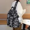 Mochila Escolar Refletiva com Grafite para Mulheres 2025 Novo Design de Nicho Mochila Casual para Alunos do Ensino Fundamental II e Médio Mochila de Grande Capacidade