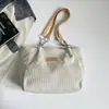 Bolso de mujer 2026 otoño nuevo estilo coreano mochila escolar para estudiante bolso de hombro simple y moderno bolso tote de gran capacidad para ir al trabajo