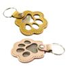 Llavero conmemorativo con forma de pata de gato para guardar el pelo de tu mascota.