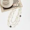Colección Larga de Collares Superpuestos de Perlas Swarovski para Mujer, Estilo Lujo Ligero, Cadena Versátil para Suéter con un Toque de Alta Gama, Venta al por Mayor Otoño e Invierno