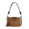 Bolso de hombro vintage de gamuza modelo nuevo 2026, bolso cruzado versátil de nicho para el día a día con correa de hombro de cuerda trenzada, bolso de axila con sensación de alta gama