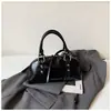 Bolsa feminina Shuai Mi Jia de cor sólida simples, nova bolsa feminina da moda, bolsa de ombro e transversal estilosa e única de nicho