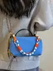 Bolso pequeño ligero y versátil de tela de nailon para mujer, nuevo bolso cruzado casual 2026, bolso para teléfono móvil exquisito y súper popular, bolso de mano pequeño