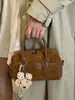 Bolso de mano casual de moda nuevo para principios de otoño de 2026, Boston de alta estética para el trabajo, bolso de hombro y cruzado