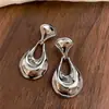 Pendientes colgantes ovalados transfronterizos europeos y americanos, lujo ligero, alta gama, modernos, pendientes sencillos, pendientes de diseño nicho para mujer