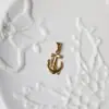 Flor de Rosa Avión Unicornio Acero de Titanio Oro de 18K Colgante Collar que no se decolora Cadena para Suéter Exportación Transfronteriza