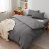 Conjunto de quatro peças de algodão puro liso para comércio exterior, modelo novo de primavera, lençol e capa de edredom 100% algodão para casa, atacado para hotéis