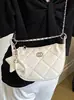 Bolso estilo Chanel de estrella y luna para mujer, nuevo modelo 2026, bolso de axila de nicho de lujo ligero, bolso de cadena acolchado, bolso de mano y bolso cruzado