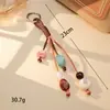Moda Vintage Cuerda de Cuero PU Bolso Tejido a Mano Encanto Nicho Acrílico con Cuentas Colgante Encanto de Bolso Encanto para Teléfono