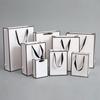 Bolsa de Papel Blanco Bolso de Mano de Cartón Blanco Venta al por Mayor Bolsa de Regalo Papel Tienda de Ropa Tienda de Juguetes Joyería Bolsa de Compras