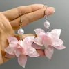 Pendientes de borla de perlas dulces florales estilo bosque, pendientes nicho simples versátiles, pendientes femeninos elegantes con un toque único de alta gama