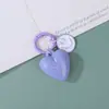 Llavero de color sólido Dopamina con forma de corazón y cara sonriente Accesorio DIY Llavero hecho a mano con cuentas Colgante para bolso