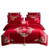 Nuevo conjunto de boda de cuatro piezas 100% algodón bordado 2026, con un diseño lujoso y elegante de algodón de fibra larga, en estilo chino tradicional y color rojo vibrante para bodas