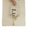 Pensamientos Cálidos de Niña Colgante Cruzado Retro Estilo Francés Pulsera de Perlas, Diseño de Nicho, Estilo Lujo Ligero, Pulsera Elegante