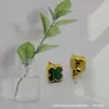 Pendientes de Trébol de Cuatro Hojas Mini de 9 mm de Venta Caliente Transfronteriza, Joyería Sencilla para Mujer, Pendientes de Acero de Titanio Color Oro 18K Conservante de Color por Vacío