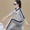 2026 Novo Conjunto Esportivo Casual Estilo Primavera e Outono Moletom de Gola Redonda Manga Longa Conjunto de Duas Peças Solto Tamanho Grande Moderno para Mulheres