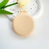 Espejo redondo mini de color macarrón con peine, peine plegable de cojín de aire portátil para mujer, peine de peluquería y masaje transfronterizo