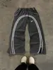 Marca de Moda Callejera Americana Transfronteriza Europea y Americana Pantalones Deportivos Casuales Rectos Holgados de Empalme de Color Puro Pantalones de Chándal con Cremallera para Hombres y Mujeres