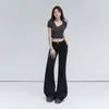 Jeans acampanados de cintura baja estilo retro americano de 4 colores para el Otoño 2026, ligeramente elásticos, versátiles, corte ajustado, jeans adelgazantes para mujer