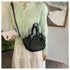 Bolso tejido de color sólido de nicho transfronterizo para mujer, nuevo modelo de moda 2026, versátil bolso de hombro y cruzado