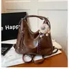 Mochila vintage, novo modelo transfronteiriço, bolsa de ombro estilosa para o dia a dia, bolsa tote crossbody, bolsa de mão casual de grande capacidade, versátil e moderna