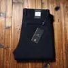 Estación europea hombres otoño e invierno grueso interior cepillado sarga hombres pantalones no planchar cómodos algodón rectos holgados casuales pantalones