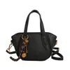 Las populares bolsas pequeñas de este año para mujer en el verano de 2025 son nuevos bolsos cruzados de moda, mochilas tipo cubo de mano estilo coreano ins