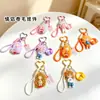 Llavero Colgante Estilo Pareja Fresco de Moda Dibujos Animados Niño Niña Ola Grande Muñeca de Bomba de Leche Encanto para Bolso de Mujer Regalo