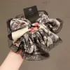 Elástico para coleta baja con lazo elegante, accesorio para el cabello para atar y peinar el cabello, diadema con estampado de leopardo, nuevo estilo 2026, cuerda para el cabello de estilo casual