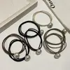 Cuerda Elegante para el Cabello con Cabeza de Perla Corea del Sur Dongdaemun Simple para Mujer Todo Fósforo Base Caucho Negro Tendón Cuerda para el Cabello Accesorios para el Cabello