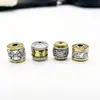 Al por mayor DIY hecho a mano dos colores con cuentas Xizang aleación de plata agujero grande cuentas de barril Xiangyun seis palabras cuentas sueltas pulsera collar accesorios