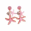 Pendientes de resina con forma de estrella de mar y concha de aguja plateada, pendientes exquisitos estilo resort costero, pendientes de diseño nicho para mujer con un toque de alta gama