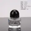 Botella de perfume cilíndrica de vidrio transparente botella secundaria de perfume botella con pulverizador de presión de alta gama portátil muestra cosmética botella vacía