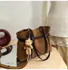 Bolsa Tote Feminina Grande Capacidade em Camurça Transfronteiriça 2026 Tendência Retro Início da Primavera Alça de Couro Moda Bolsa de Ombro